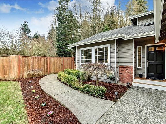 Freshly painted exterior, established landscaping! Paved walkway to the back of the home. 