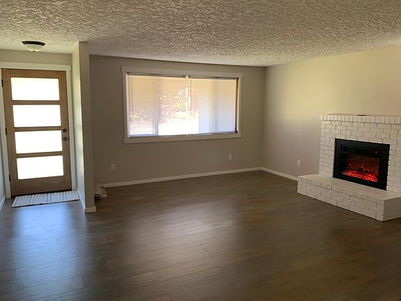 New front door,new flooring, painted fireplace with remote electric fireplace insert and paint.