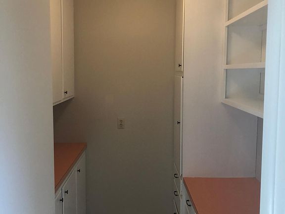 Storage, laundry, or office room.