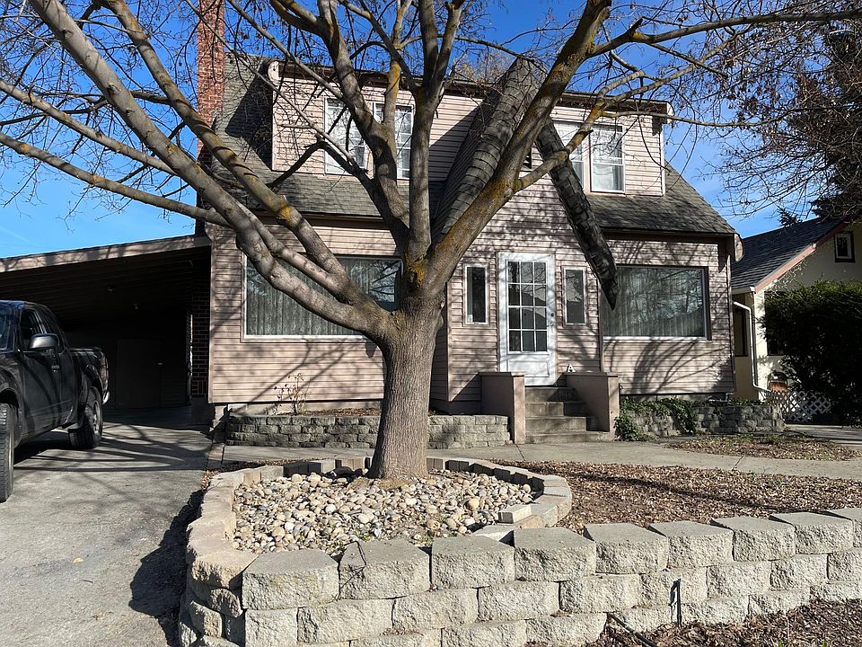 Front of House with Door and Carport