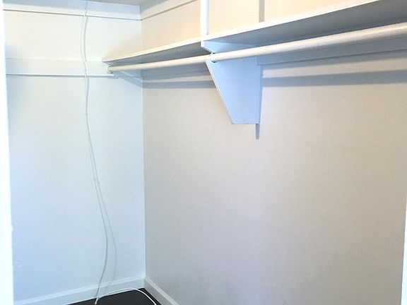 Showcase your accessories and books on the built-in shelves of your walk-in closet.