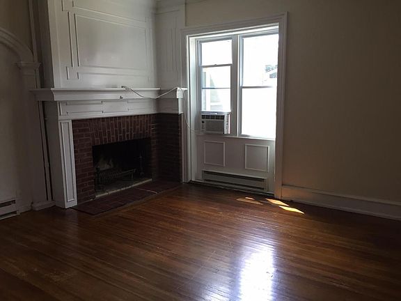 Large living room with lots of natural light.