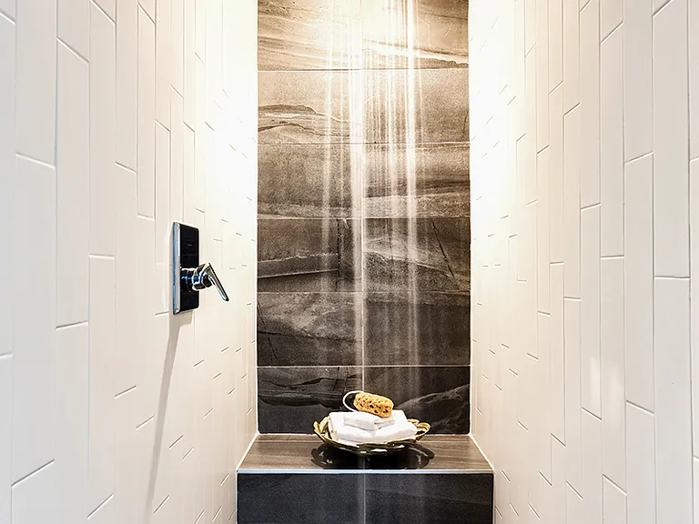 Stunning walk in shower with tile flooring