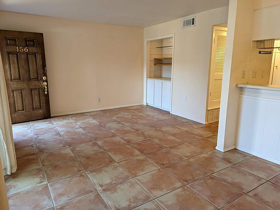 View of living area. Front door in top left.
