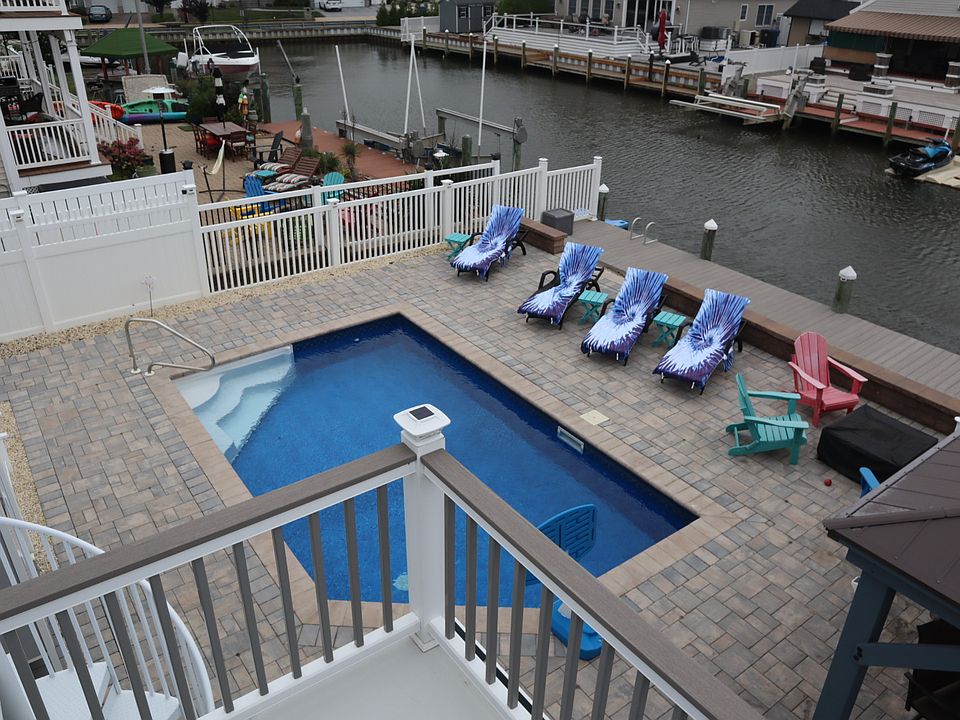 Pool view from the upstairs deck- (Lounge chairs included)