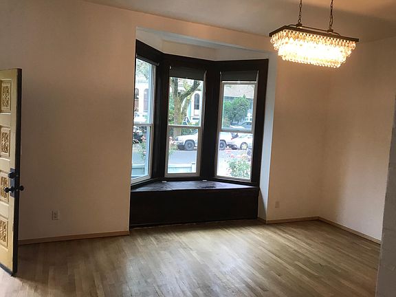 Lovely Bay Windows w/ New Window Coverings. Window Seat with