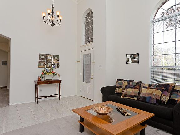 GRAND TWO STORY ENTRANCE WITH CHANDELIER