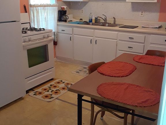 Brand New Refrigerator, Gas stove, the cupboards are cleaned out for your own stuff but we can provide pots, pans, dishes, glasses, kitchen utensils, silverware if needed.