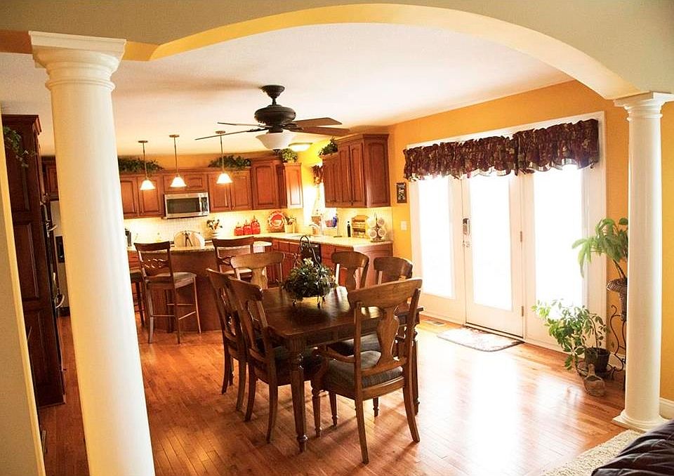 Detailed archways looking into this elegant kitchen loaded with all the modern amenities.