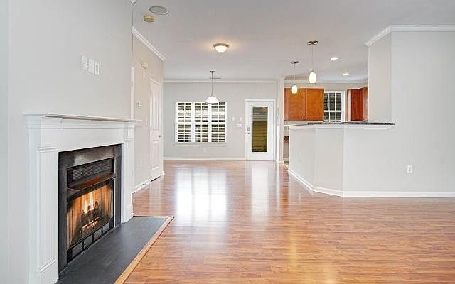 Spacious living open to dining and kitchen (bar top)