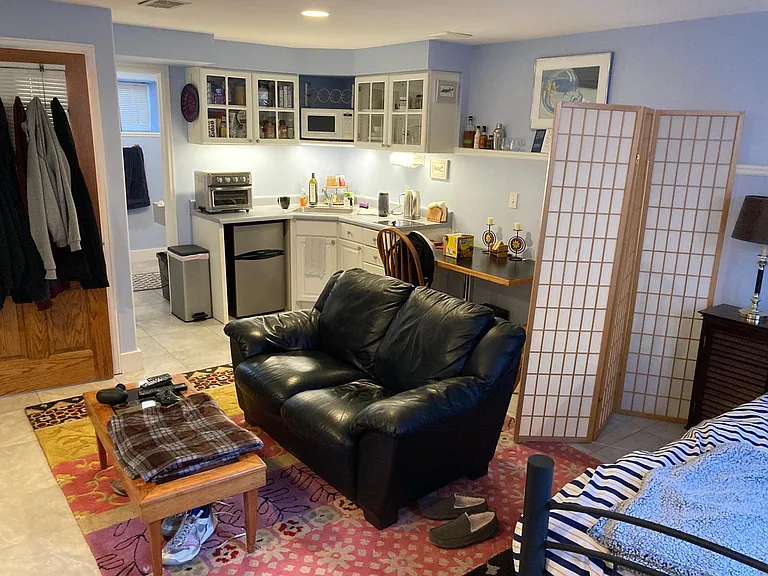 living area showing kitchen area. the small refrigerator has been replaced with a bigger one