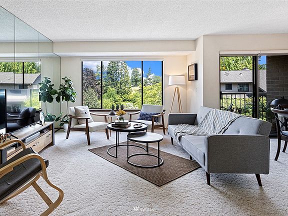 Open floorplan features picture windows capturing expansive territorial views to the East.
