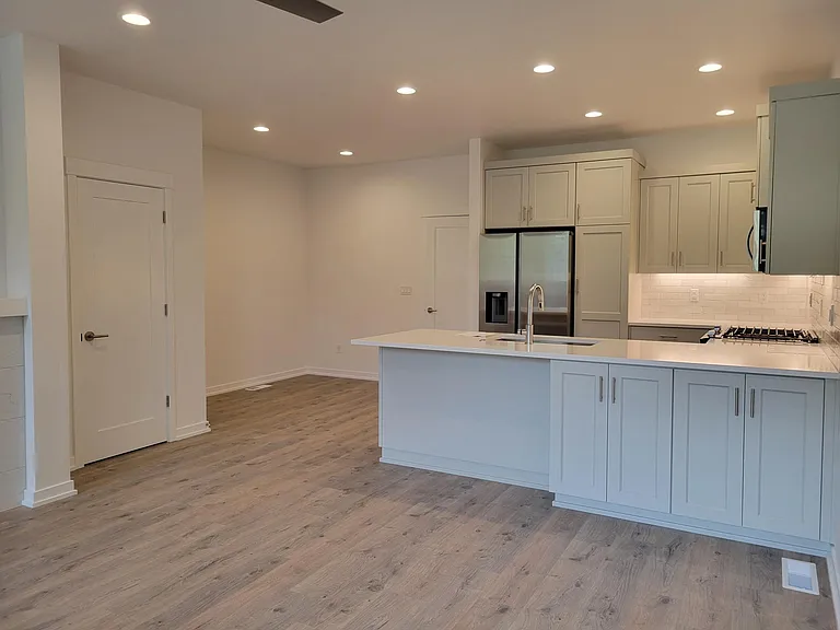 Another view of kitchen and dining area