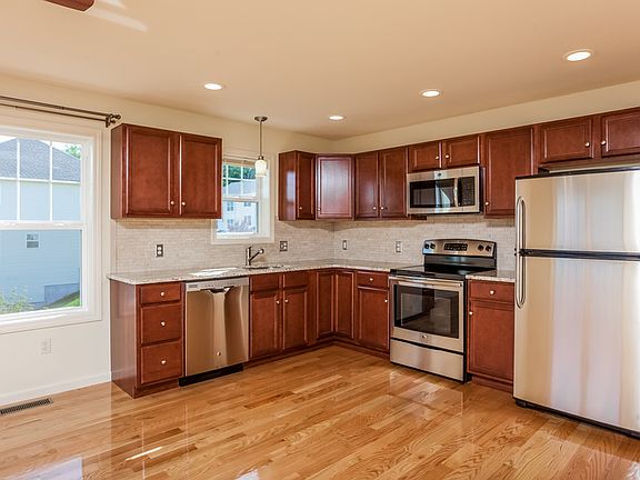 Maple wood cabinets, granite countertops and stainless steel appliances.