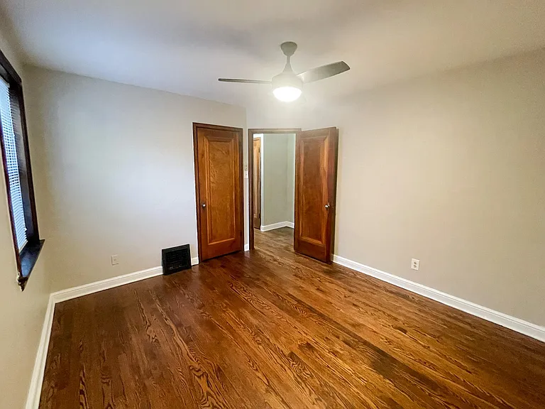 View of bedroom and entry door.
