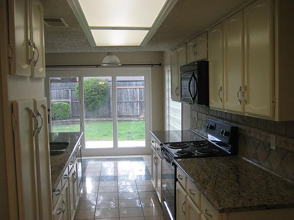 Kitchen facing toward backyard