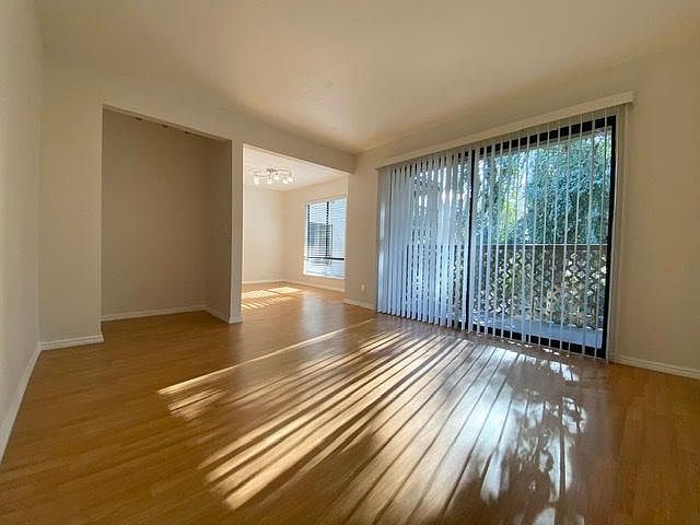 Living room with lots of natural light and balcony