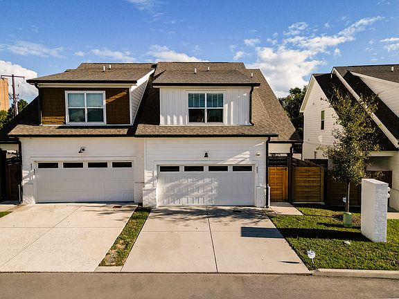 Two car garage, equipped with electric car charging outlet