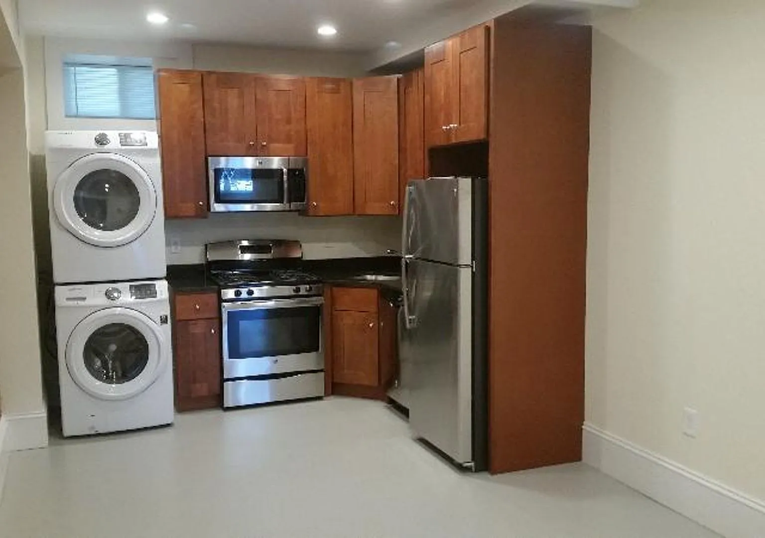 Nicely updated ground level 1 bed with in-unit laundry near the Green Line. — Photo 1