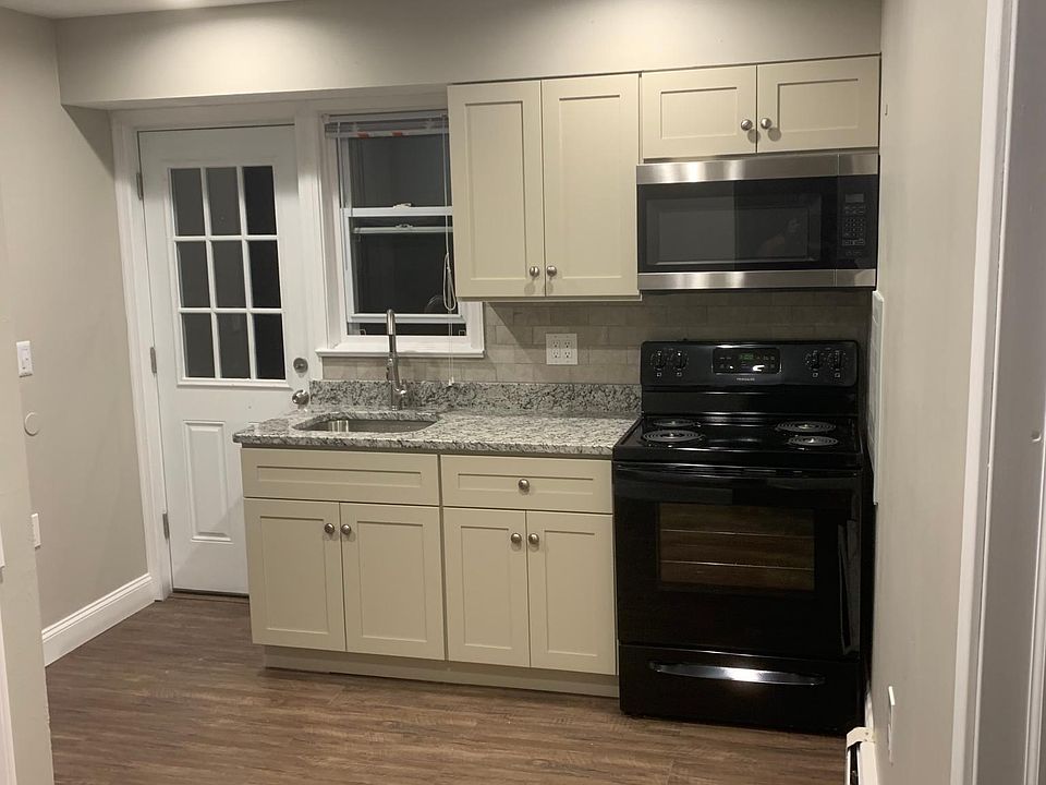Kitchen with built in Microwave and granite counter top