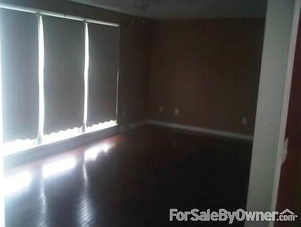 Living Room
						:
						Three floor to ceiling windows let in lots of light. Designer/neutral colors