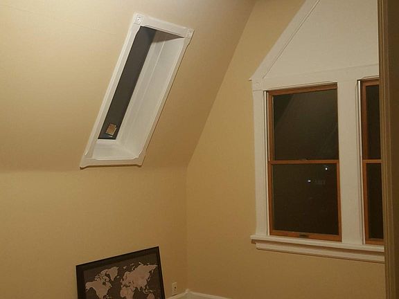 Bedroom #1 with high ceilings, 2 closets + skylights