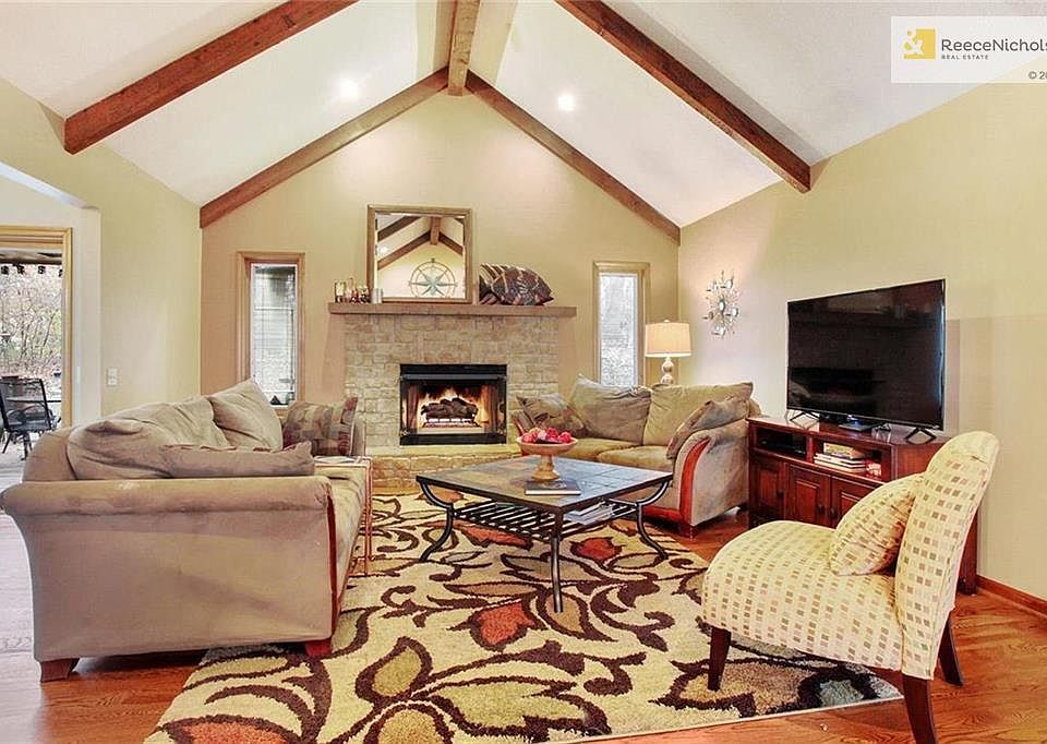 Enter into the large living room with hardwood floors, vaulted ceilings, and gas fireplace. A warm and cozy spot to hang out!