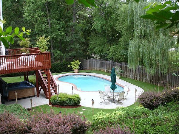 Spectacular view of pool and surrounding lush landscaping.