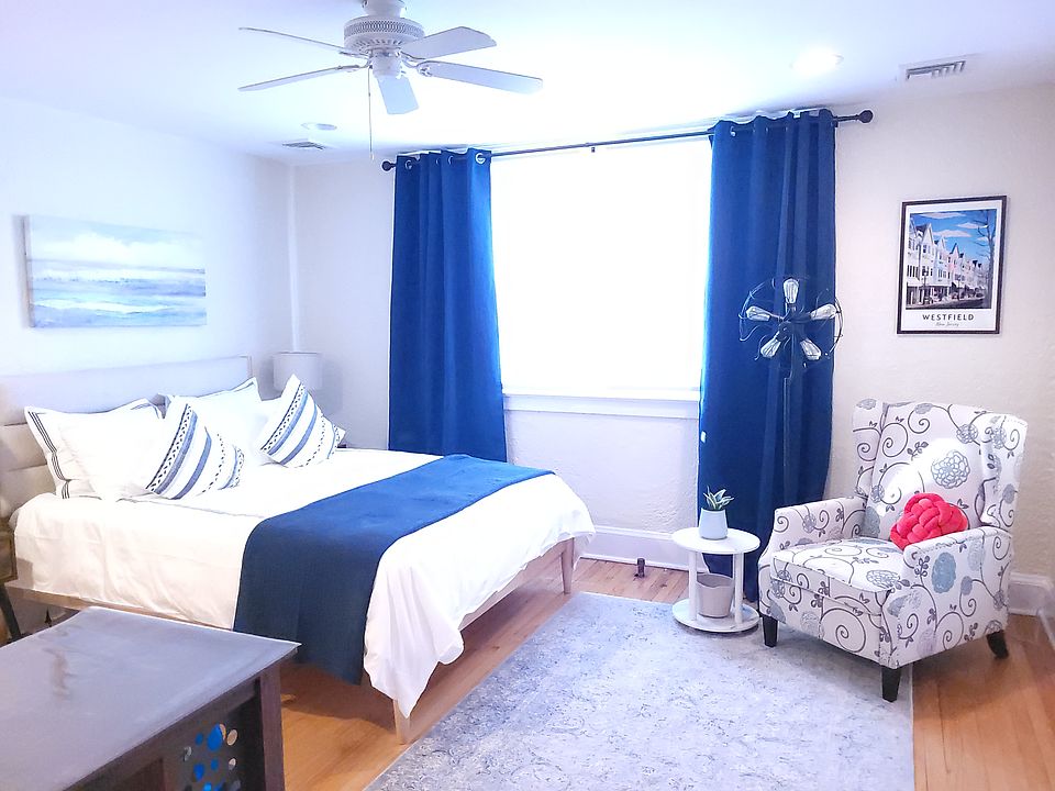 The studio features a queen-size bed with luxury bedding and blackout curtains to ensure a great night's sleep.