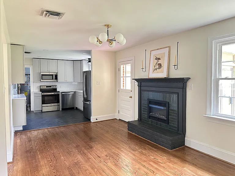 Large den, eat in kitchen with electric fireplace.