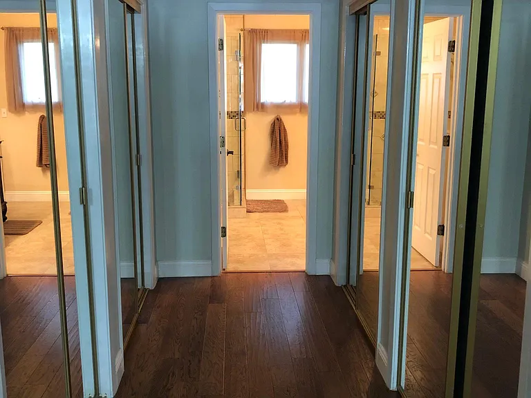 Master bedroom hallway to master bath with 4 large closets