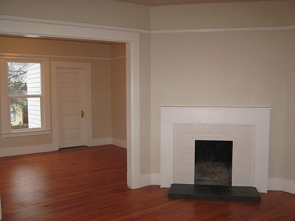 Living room opens to dining room. Fireplace is not functional.
