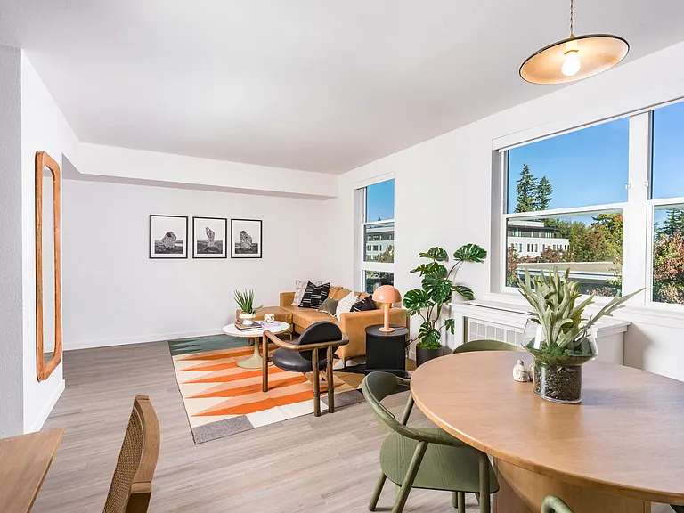 Experience the warmth of natural light through oversized windows at Modera Woodstock, creating a bright, inviting space.