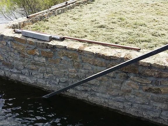 105 Minton Lane - Water is about 3 feet deep at the retaining wall with the lake at Spillway level.