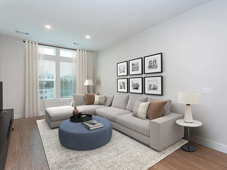 Spacious living room with hard-surface vinyl plank flooring throughout
