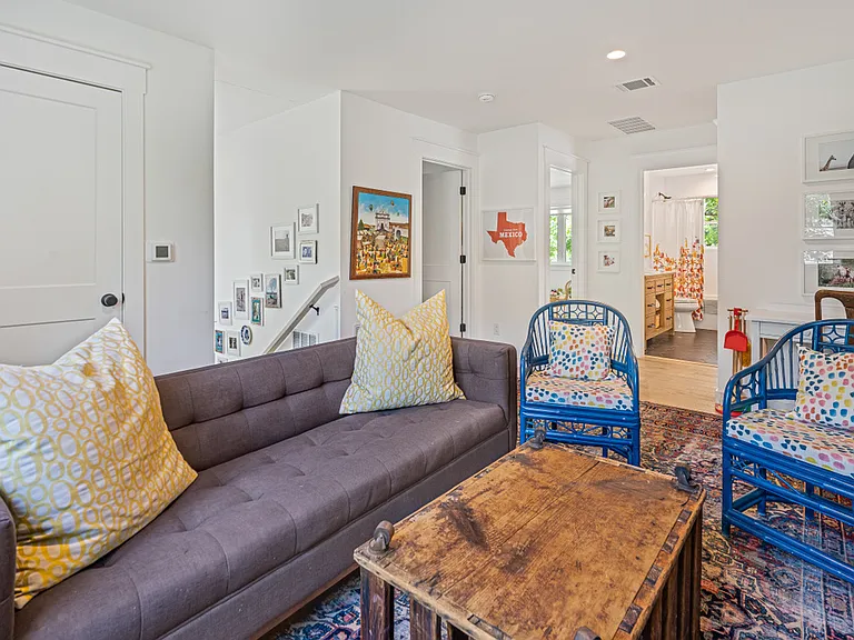 upstairs family room with view into jack and jill bathroom and, to the left, one of the upstairs bedrooms.
