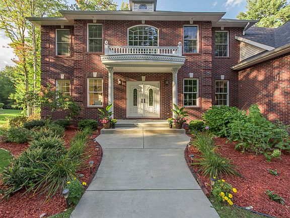 Welcome your guests with this wonderful grand entrance complete with updated landscaping, decorative columns and Juliet balcony.