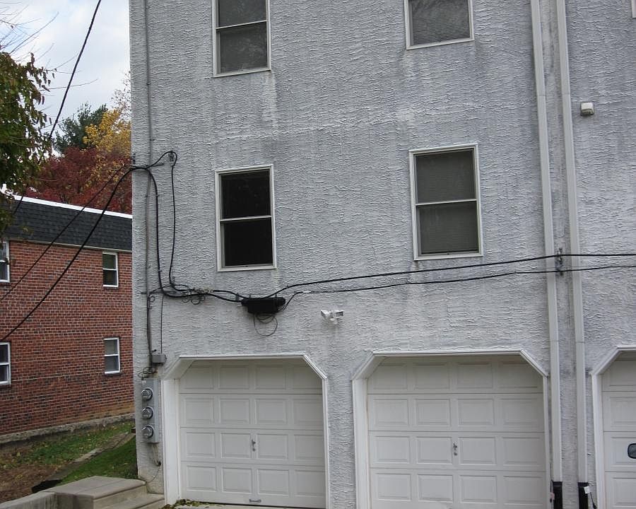 One garage with parking behind it.