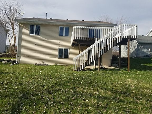 Back of the house with a large deck and a private back yard. Remodeled in 2024