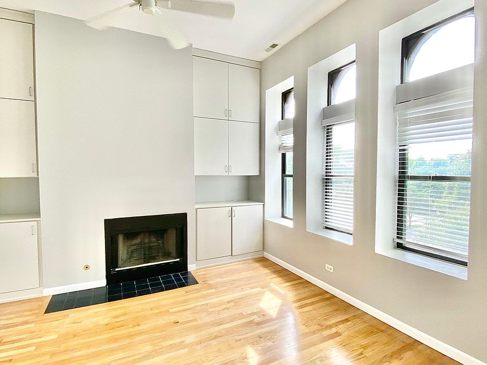 Spacious, modern living room. Lots of storage, gas fireplace, ceiling fan. Natural lighting. Wood floor recently treated!