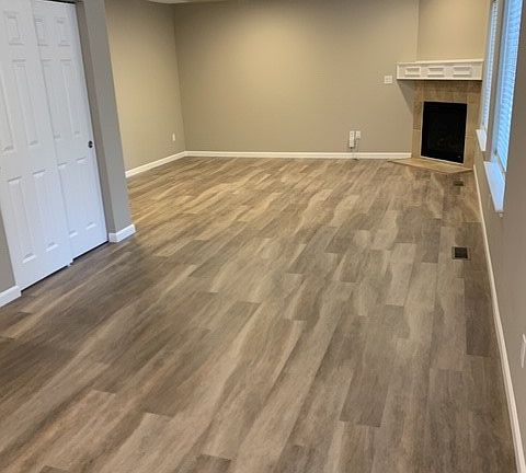 Family room with LVP flooring and gas fireplace