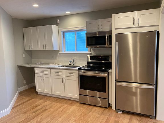 Kitchen comes with brand new appliances including microwave, stove, and refrigerator (no space for dishwasher)
