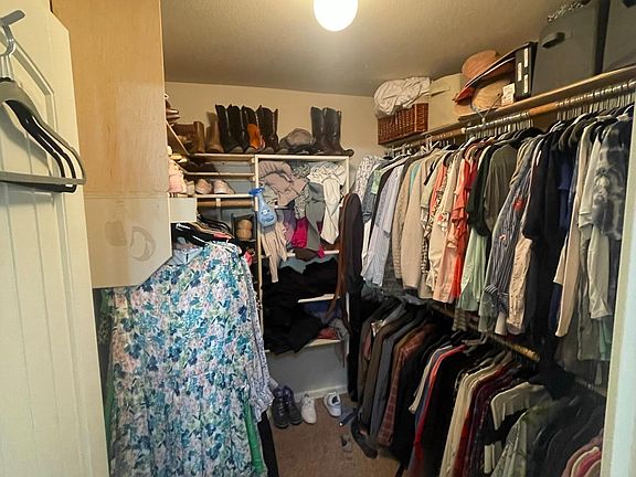 Large walk in primary closet with tons of storage!