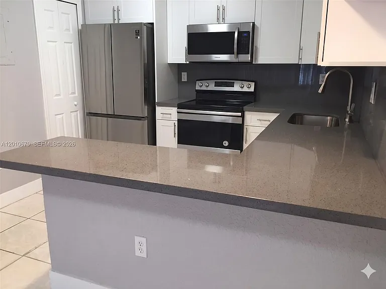 8888 SW 131st Ct #406 — Photo 2