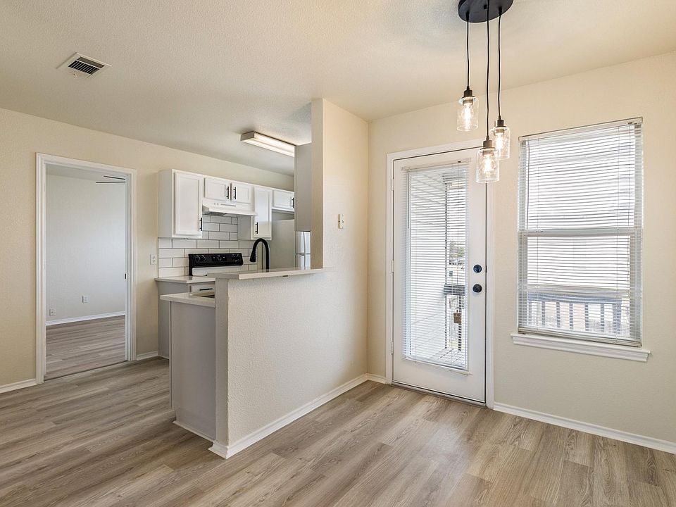 Brightly lit dining and kitchen area