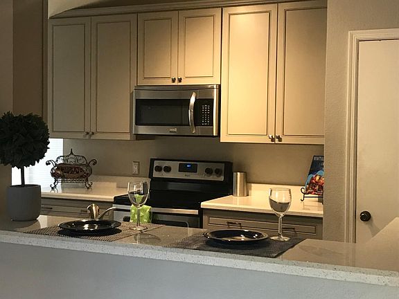 Bar height counter top in dining room looking into kitchen