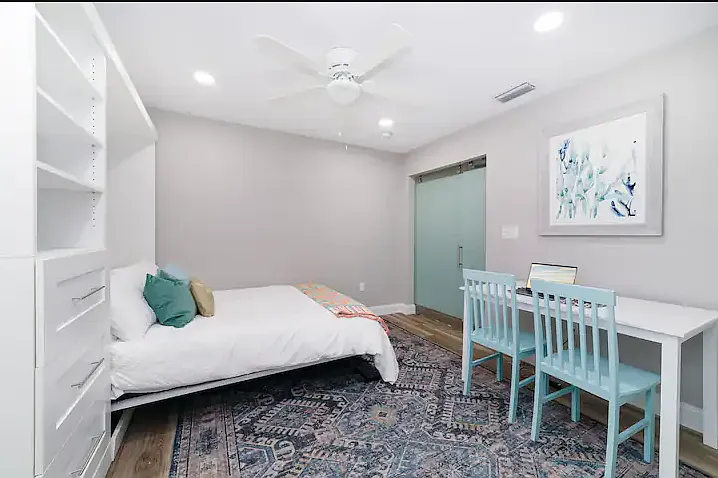 The first-floor bedroom has a full murphy bed that folds up into the wall and workspace that can be converted into a table for 4. Use the room as you want!
