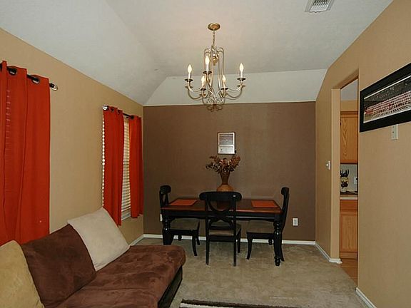 The dining room is nicely sized and offers space for additional furniture options. As you can see the current owners have added a couch to make this area a combination formal living and dining room!