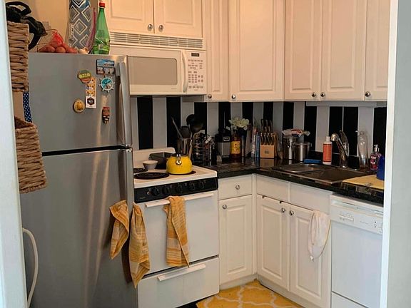 Kitchen featuring stainless steel refrigerator and dishwasher.