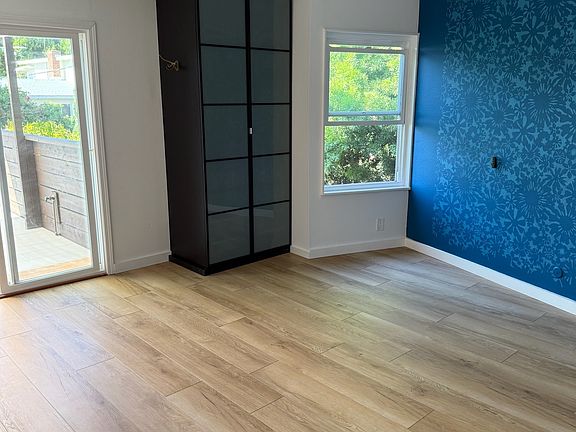 Master suite with private deck access and abundant natural light